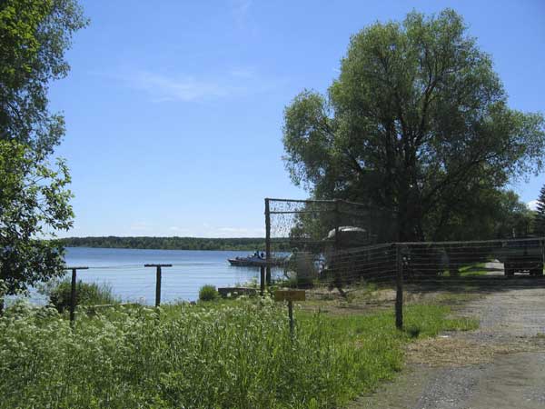 a Russian lake patrol boat at a dock just beyond the border