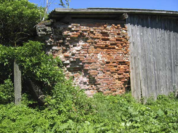 from the rear and shows a bricked up window